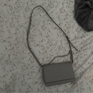 Gray medium size crossbody. Gently used. With silver chain. Kate spade